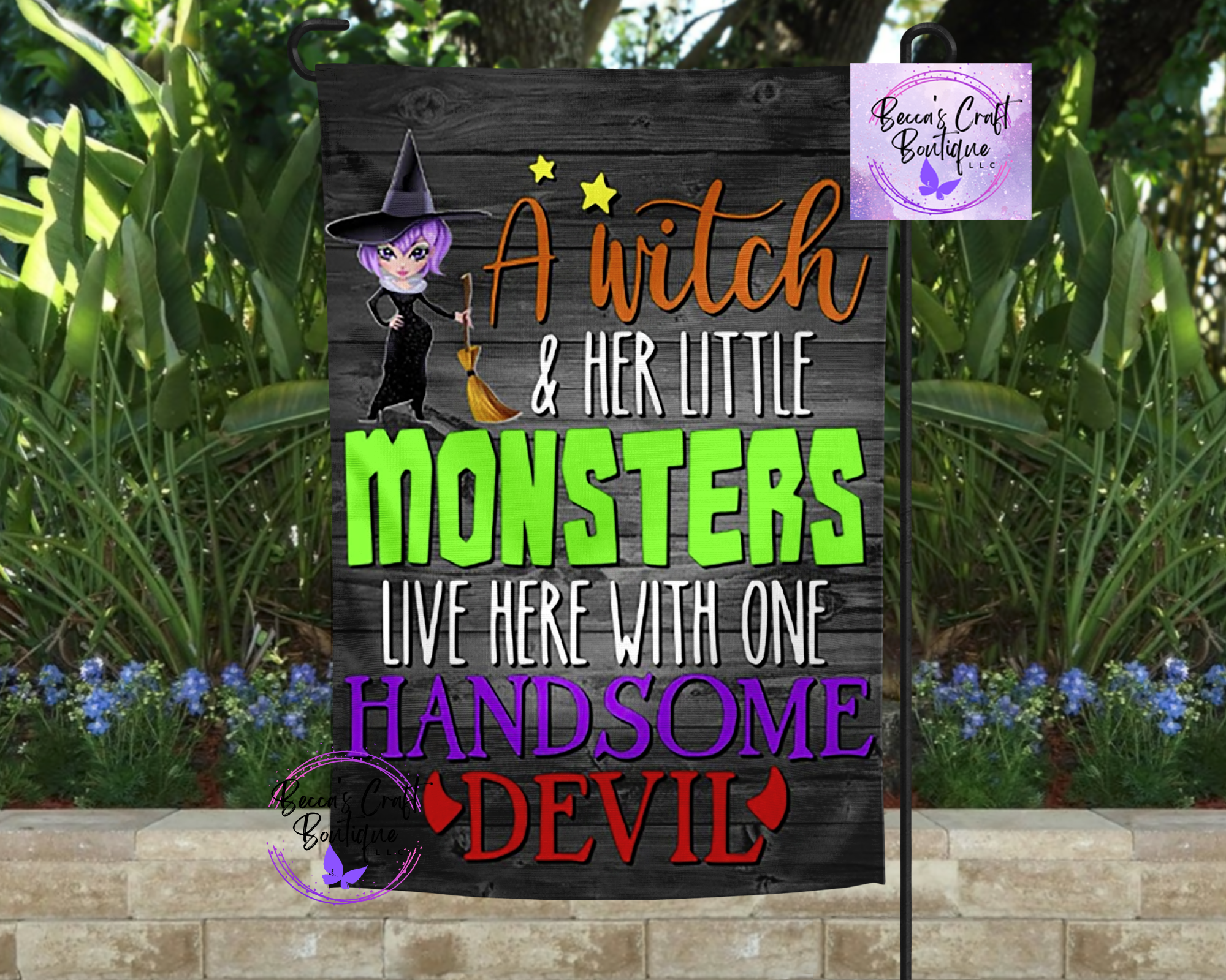 a witch and her monsters garden flag